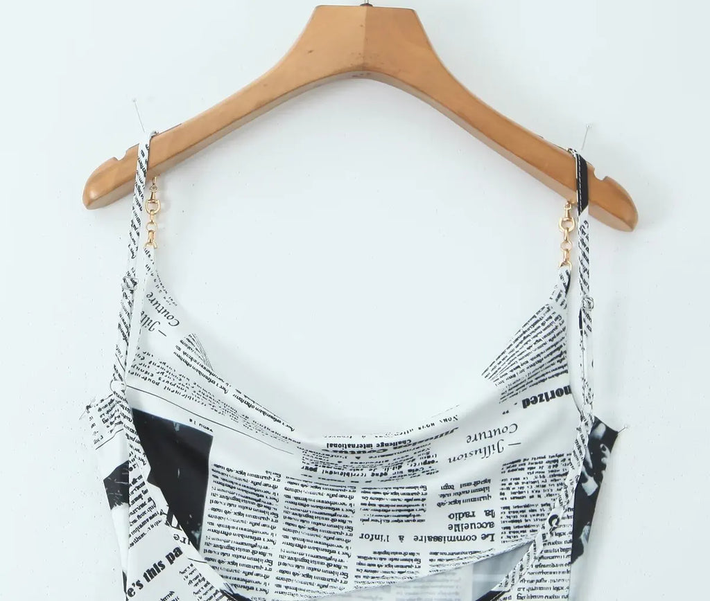 YENKYE New Women Newspaper Letter Print Irregular Hem Sling Dresses Fashion Backless Thin Straps With Chain Summer Sexy Dress